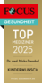 A badge featuring the text “TOP MEDIZINER 2025” for Dr. med. Mirko Dannhof, recognized for expertise in "Kinderwunsch" (desire for children). The badge includes the "FOCUS GESUNDHEIT" logo and a web address for more information. The background is gold.